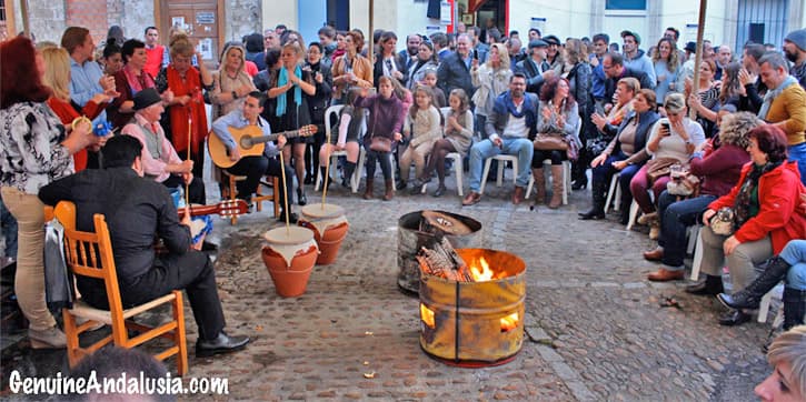 People playing guitar and singing in a zambomba in Jerez