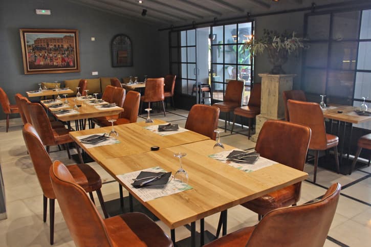 tables and chairs in the dining areas of restaurant AQ35 in Jerez