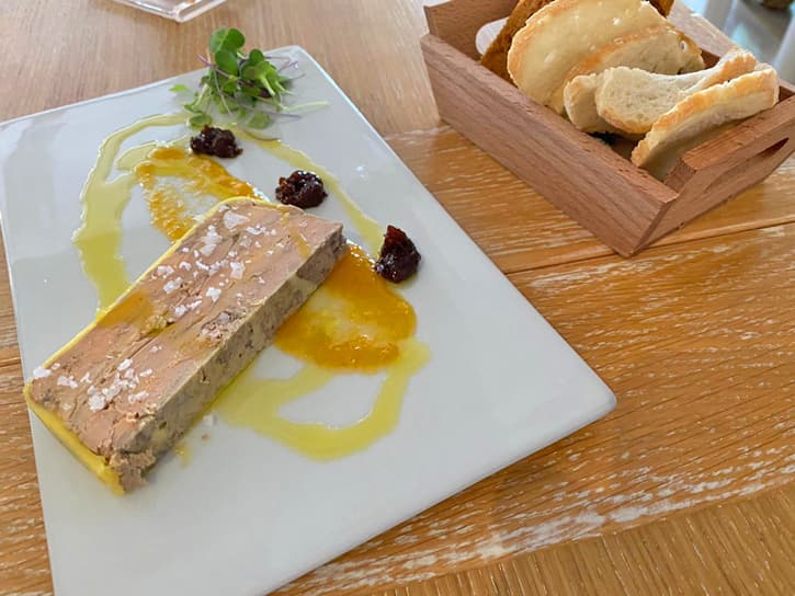 A plate with a portion of homemade foie gras