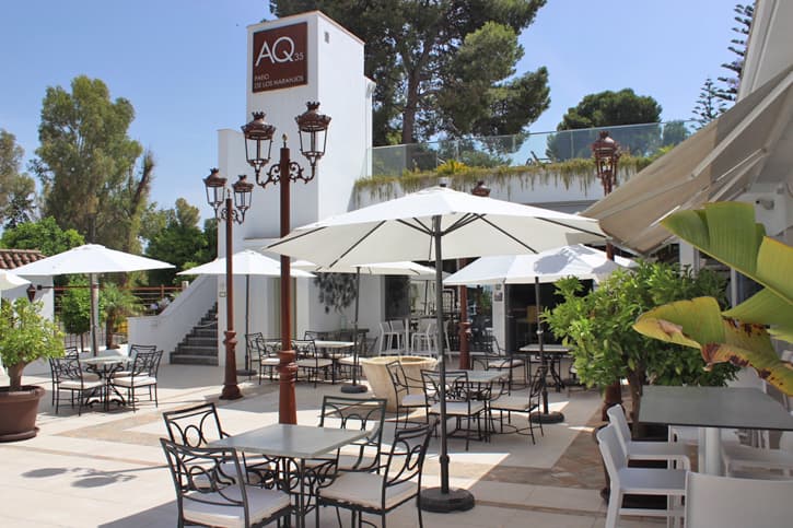 Tables and chairs on an outdoor restaurant setting in Jerez